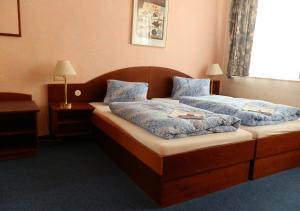 Ένα ή περισσότερα κρεβάτια σε δωμάτιο στο Hotel Goethe