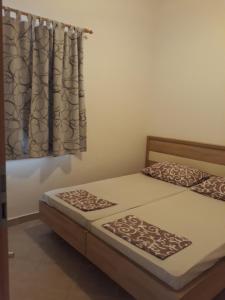 Postel nebo postele na pokoji v ubytování Apartments Jurjevic