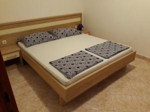 Postel nebo postele na pokoji v ubytování Apartments Jurjevic