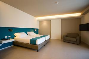 Postel nebo postele na pokoji v ubytování Airone City Hotel