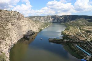 an aerial view of a river in a canyon at Camping Port Massaluca in Pobla de Masaluca
