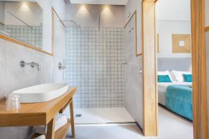 A bed or beds in a room at La Piazzetta Guest House