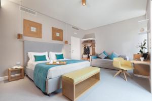 A bed or beds in a room at La Piazzetta Guest House