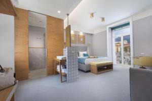A bed or beds in a room at La Piazzetta Guest House
