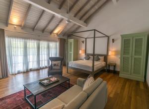 A bed or beds in a room at Fort Bazaar