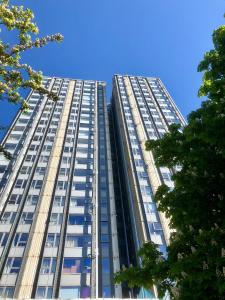 a tall building with windows on the side of it at Bray Guest Rooms in London