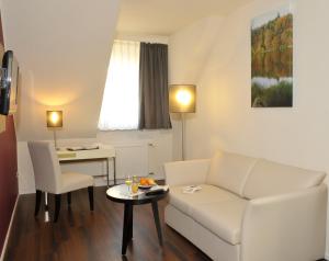 Posezení v ubytování Hotel Goldener Knopf
