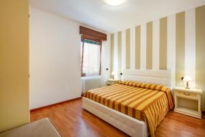 Appartamenti Mare Caorle客房内的一张或多张床位