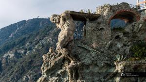 a statue sitting on the side of a mountain at Albamare in Monterosso al Mare