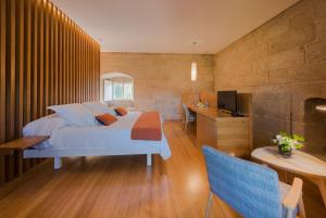 Ένα ή περισσότερα κρεβάτια σε δωμάτιο στο Torre de Tebra