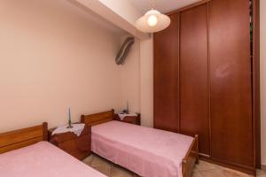 Postel nebo postele na pokoji v ubytování Kyrana Apartments