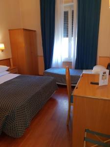 Posteľ alebo postele v izbe v ubytovaní Hotel Piemonte