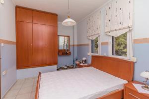 Postel nebo postele na pokoji v ubytování Kyrana Apartments