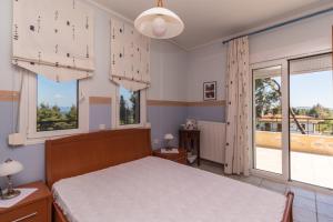 Postel nebo postele na pokoji v ubytování Kyrana Apartments