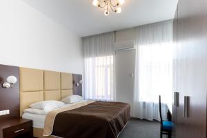 Llit o llits en una habitació de Talisman Gorokhovaya