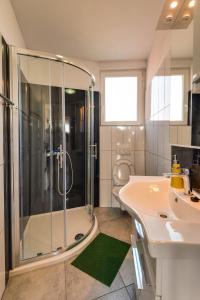 a bathroom with a shower and a sink at Jadrija 6 in Šibenik