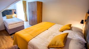 Postel nebo postele na pokoji v ubytování Holiday Village Tatralandia