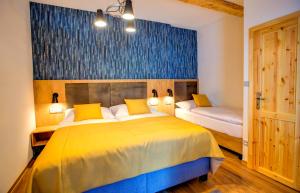 Postel nebo postele na pokoji v ubytování Holiday Village Tatralandia