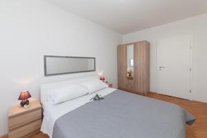Posteľ alebo postele v izbe v ubytovaní Apartman Bordura