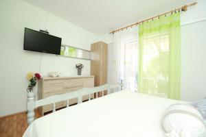 Ένα ή περισσότερα κρεβάτια σε δωμάτιο στο Apartments Marcela