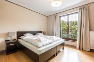 Voodi või voodid majutusasutuse Hotel Mandát toas