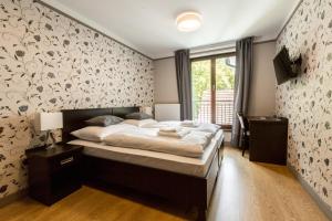 Voodi või voodid majutusasutuse Hotel Mandát toas