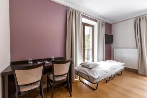 Voodi või voodid majutusasutuse Hotel Mandát toas