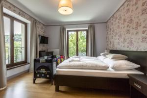 Voodi või voodid majutusasutuse Hotel Mandát toas