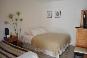 Una cama o camas en una habitación de Hotel Boutique Molzano