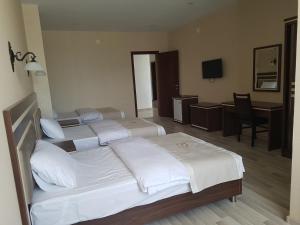 Postel nebo postele na pokoji v ubytování Hotel 725