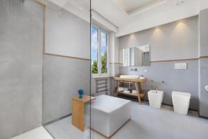 A bed or beds in a room at La Piazzetta Guest House