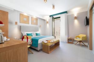 A bed or beds in a room at La Piazzetta Guest House