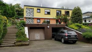 a car parked in front of a house at Zum Ehranger Wald 2a in Trier +5 photos
