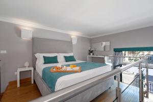 A bed or beds in a room at La Piazzetta Guest House