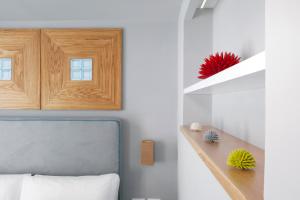 A bed or beds in a room at La Piazzetta Guest House