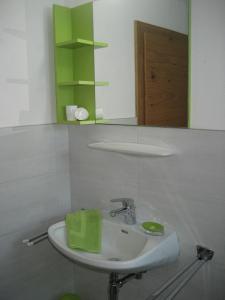 a bathroom with a sink and a mirror at Bahlerhof - Luxner Annelies in Ried im Zillertal