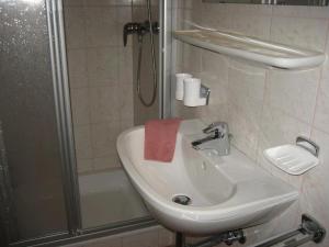 a bathroom with a sink and a shower at Bahlerhof - Luxner Annelies in Ried im Zillertal +30 photos