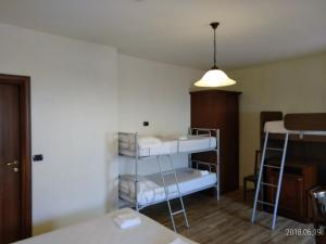 Posteľ alebo postele v izbe v ubytovaní Hotel Belvedere
