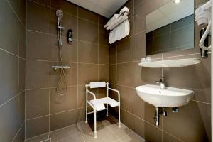a bathroom with a sink and a shower at Hotel Espresso in Amsterdam +29 photos