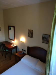 Posteľ alebo postele v izbe v ubytovaní Hotel Belvedere