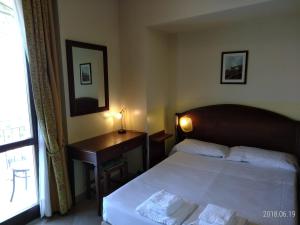 Posteľ alebo postele v izbe v ubytovaní Hotel Belvedere