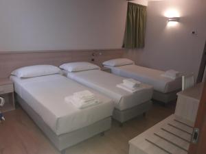 Ένα ή περισσότερα κρεβάτια σε δωμάτιο στο Albergo Diffuso Belvedere