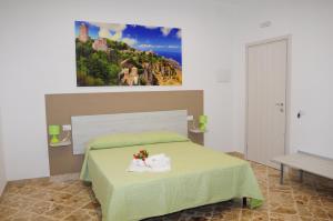 A bed or beds in a room at Le Sette Meraviglie