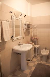 a bathroom with a sink and a toilet at Appartamenti Mori in Belluno +76 photos