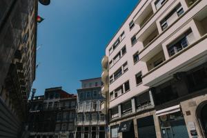 a row of buildings on a city street at Puro Apartment in Porto