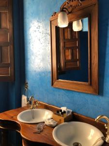 a bathroom with a sink and a mirror at Hotel Casa Imperial in Seville
