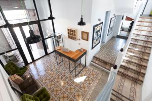 an overhead view of a living room with a table and chairs at Gran H La Marina in Altea