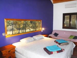 a bedroom with a white bed and a window at Tantaka - Albergue Los Meleses in Radiquero +16 photos