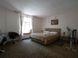 Postel nebo postele na pokoji v ubytování Salve комнаты и апартаменты