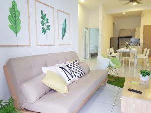 a living room with a couch and a table at No.5 The Mint @ Puchong center near IOI Mall in Puchong